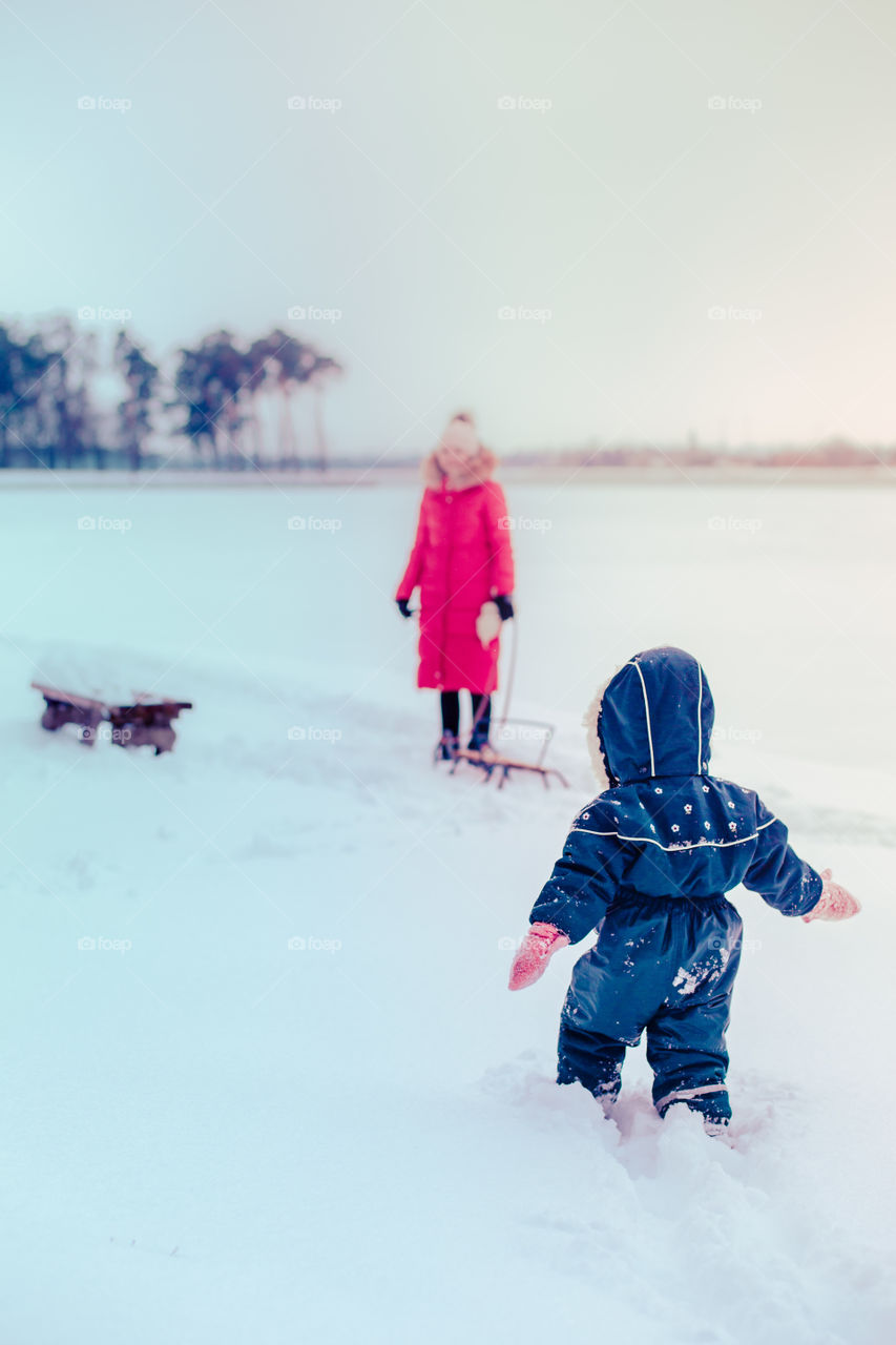 Winter with friends. Spending wintertime outdoors playing with snow