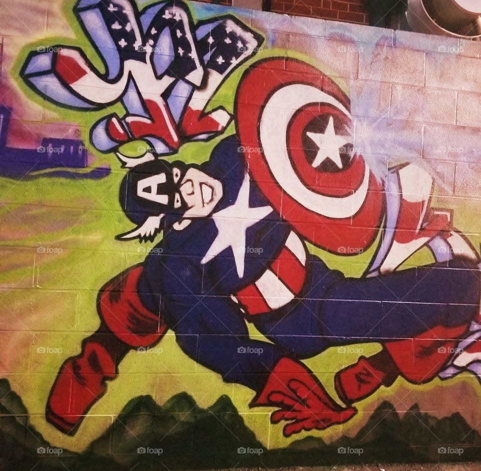 Stand out freelance city graphic art of Uptown Charlotte with bold colors of Captain America.