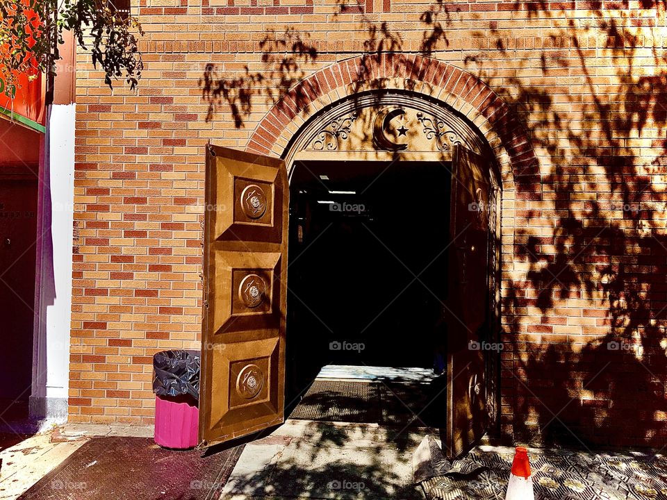 Entrance to the Mosque on Fulton Street in Brooklyn, New York photographed on a bright sunshiny early summer afternoon in 2020. Hypnotic Productions