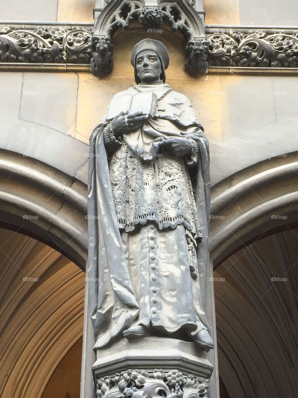 Statue of St Thomas Fisher from the doorway of the Church of Our Lady and the English Martyrs in Cambridge.