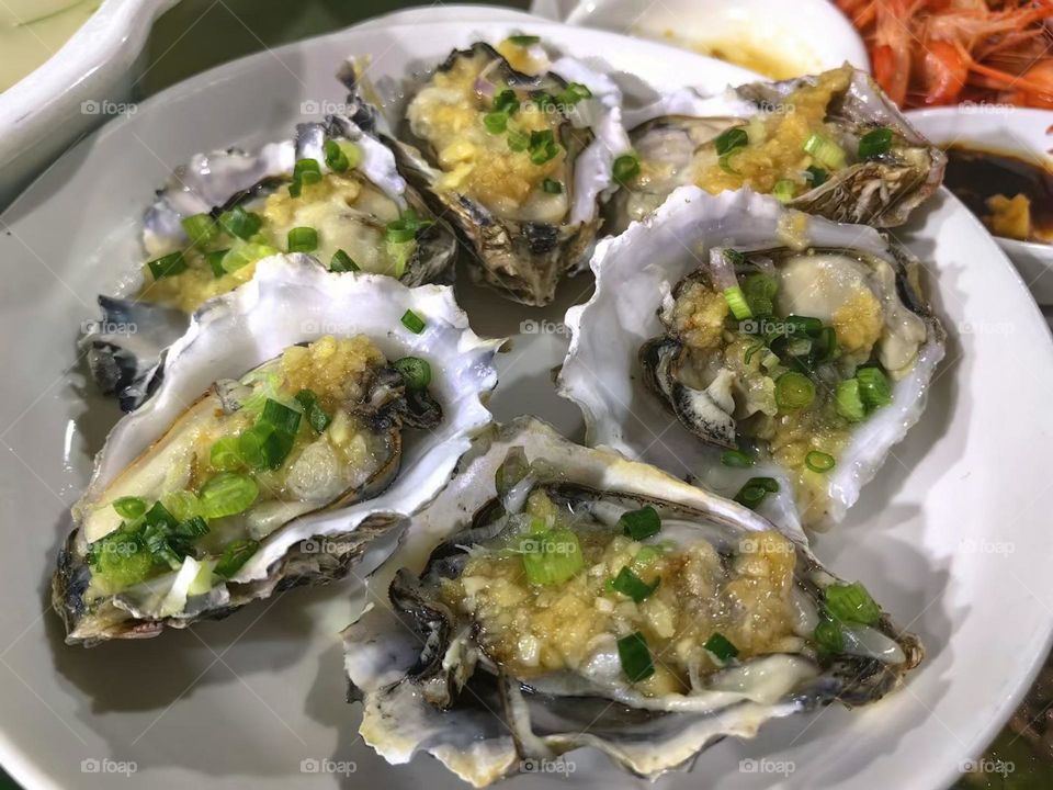 Delicious grilled oysters on the table