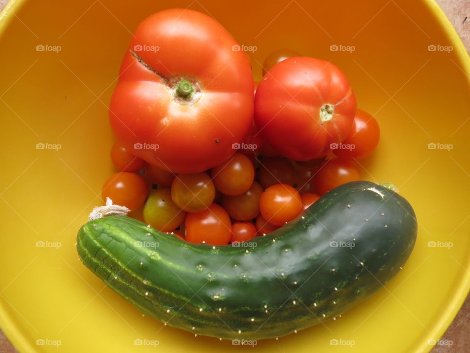 Tomatoes and cucumber happy face.