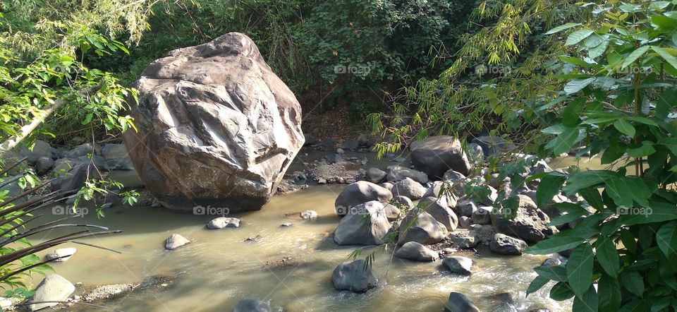 This big rock is in the middle of the river