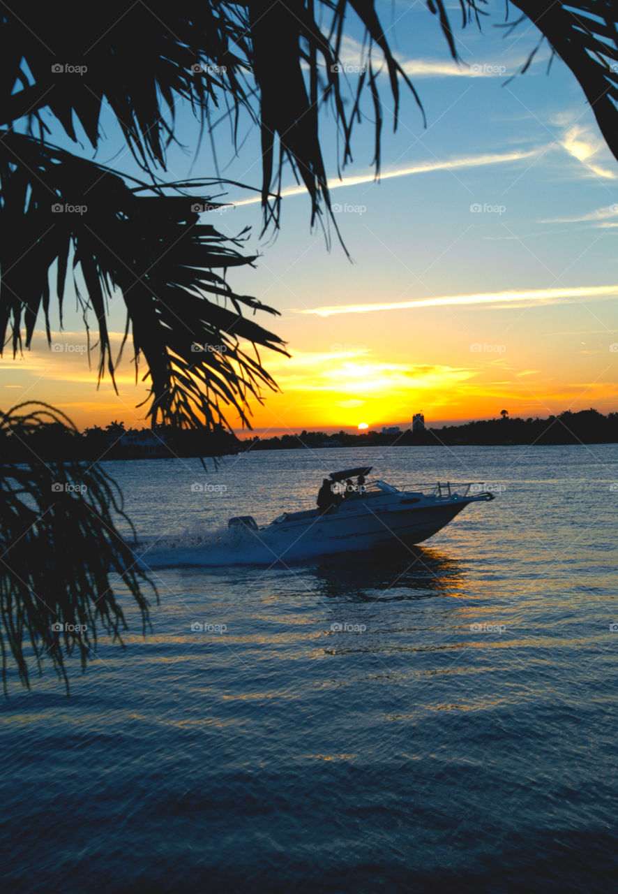 Heading home at sunset. Boater heading home at Sunset in Florida