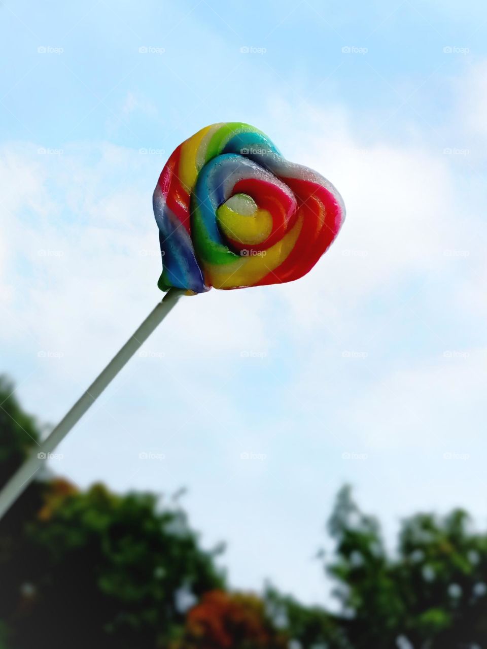 Rainbow candy against the sunny sky