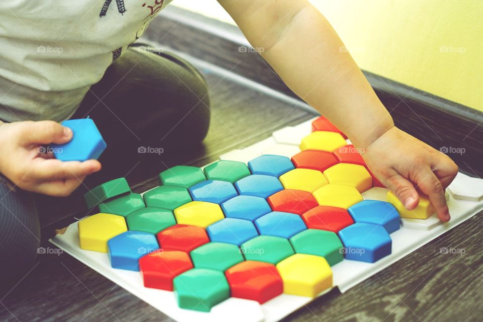 boy playing mosaic