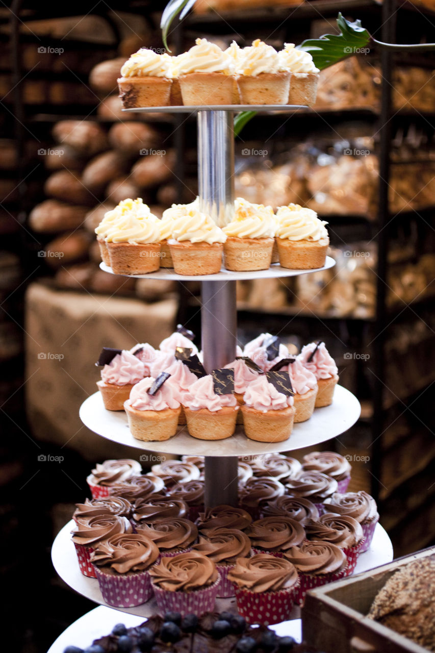 Variety of cup cakes on stand
