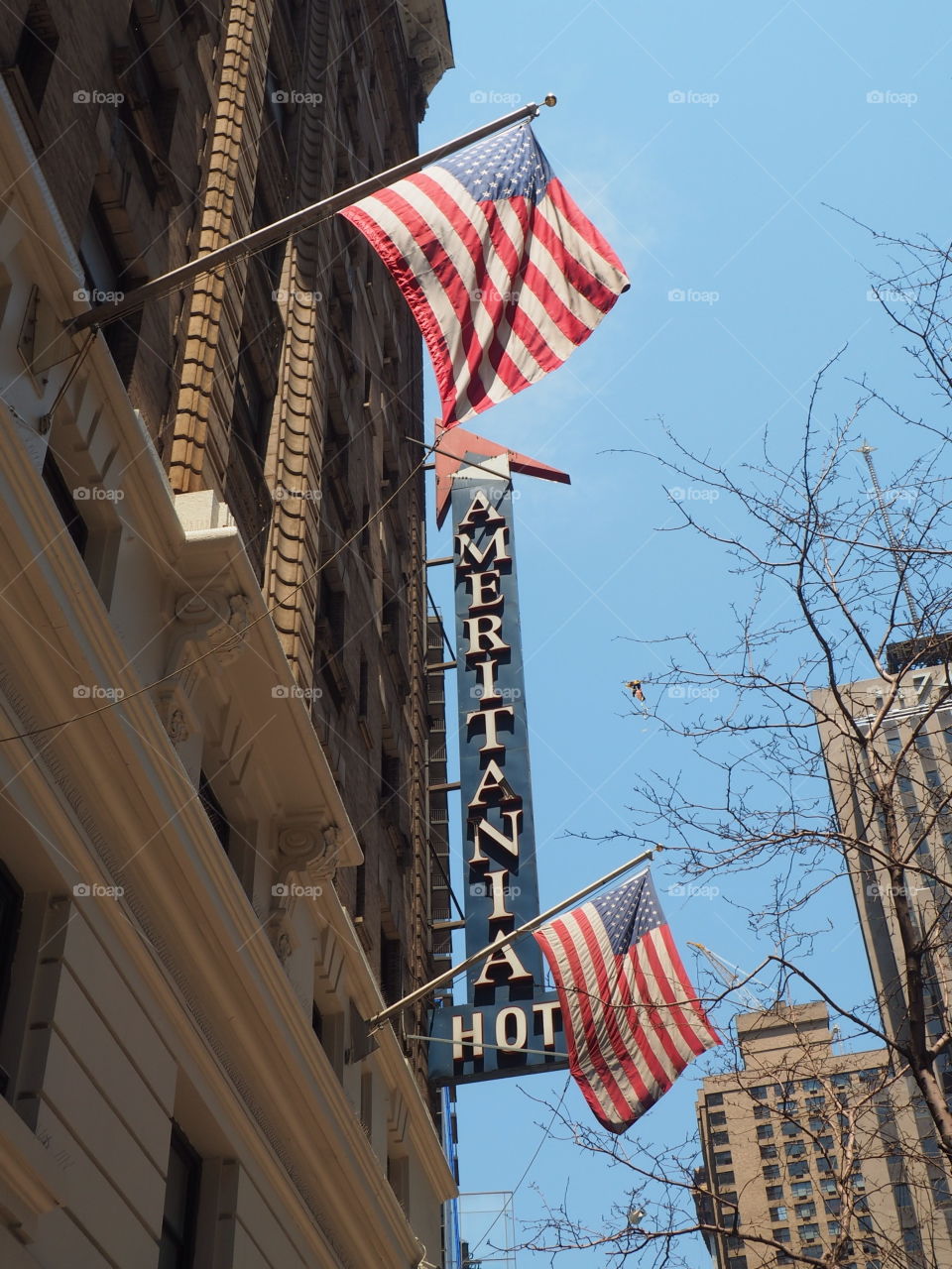 USA flags waving in a NYC New York city building