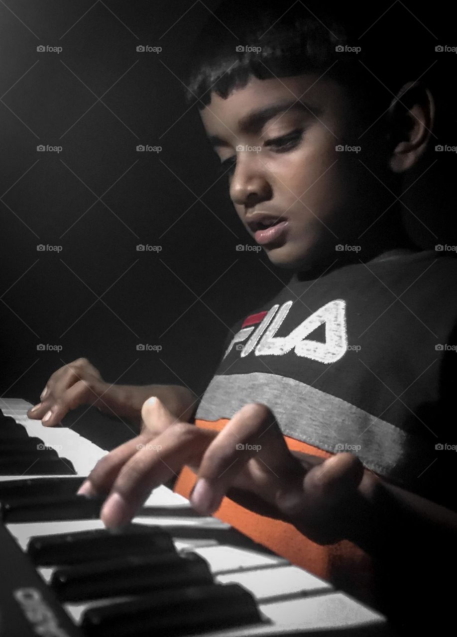 A boy playing piano 