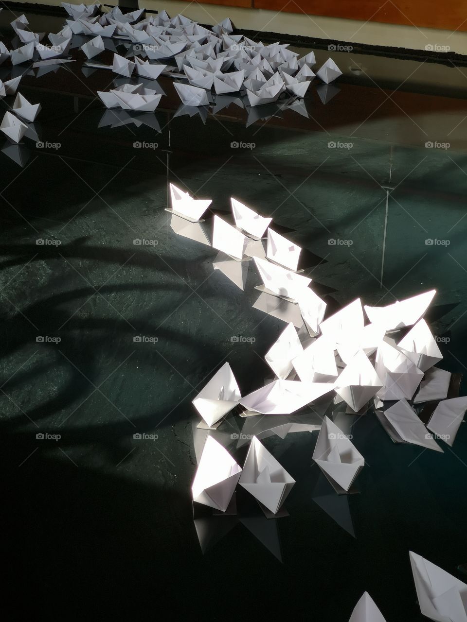 paper boats on water