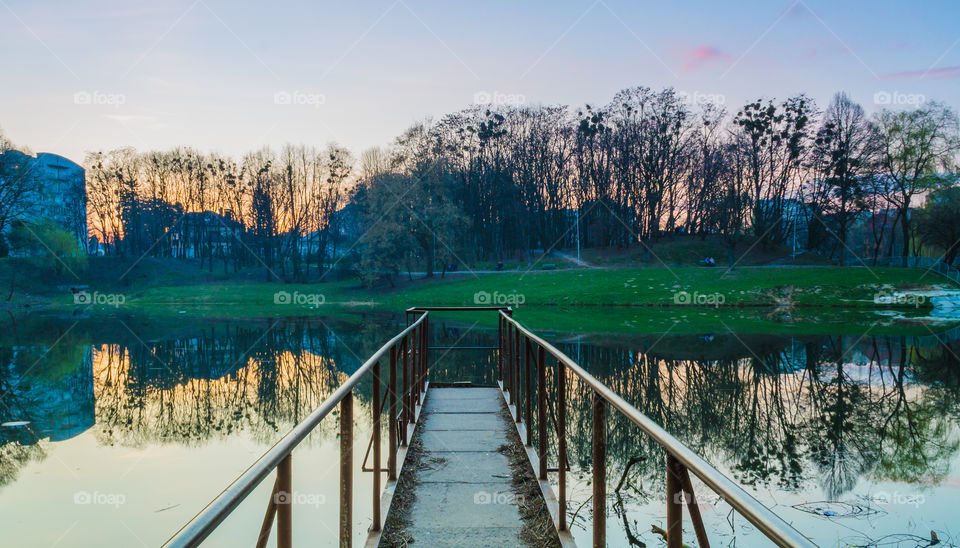 city park with lake in the spring season