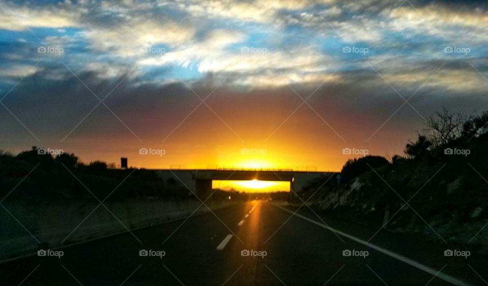 sun reflection under bridge during traveling