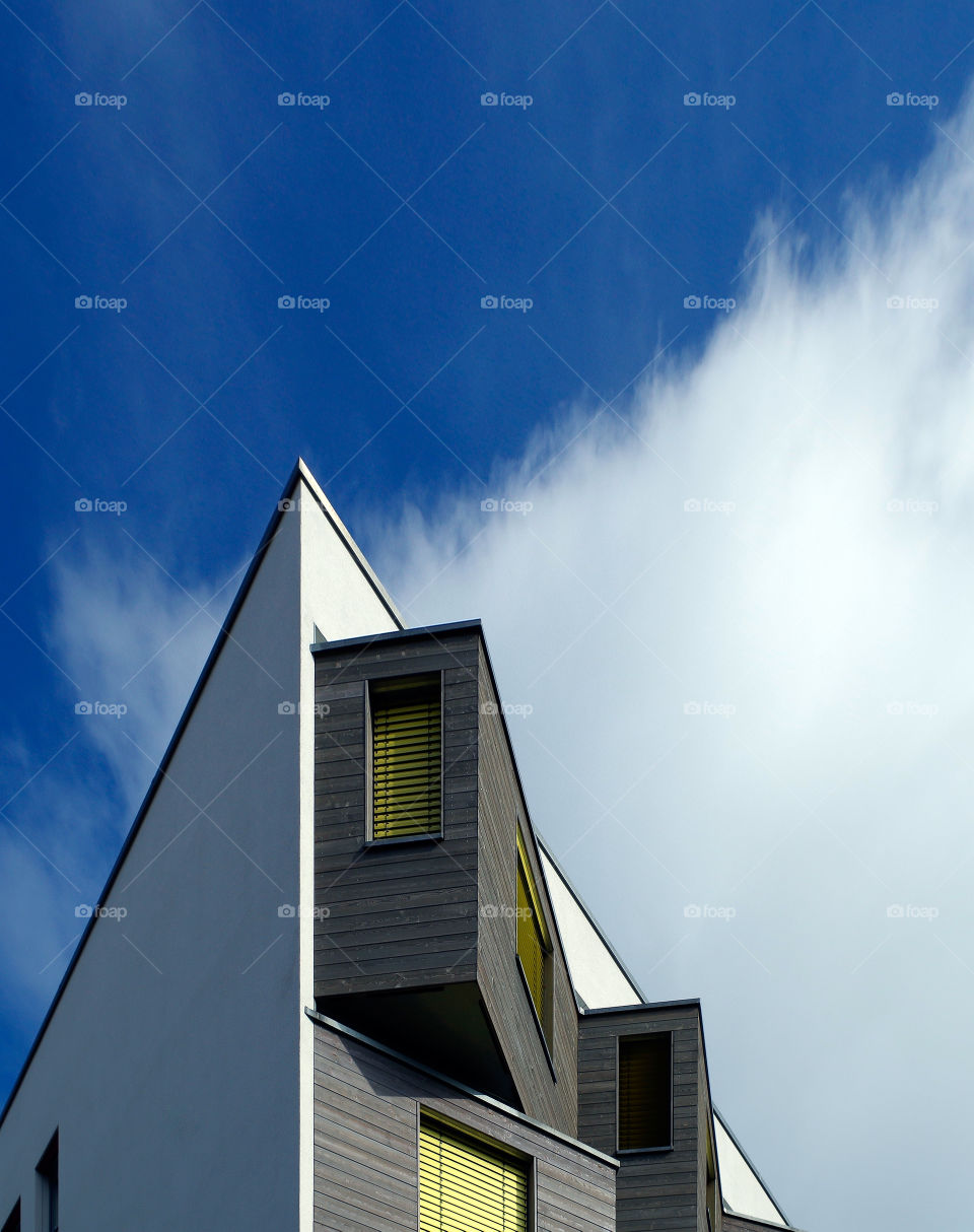 Low angle view of built structure against cloudy sky.