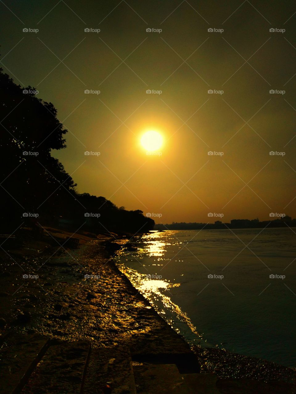 sunset beside Ganges river