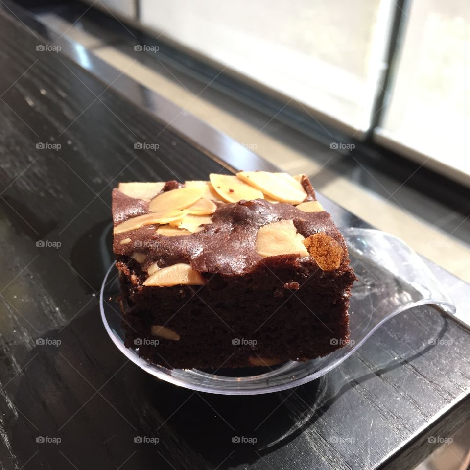Chocolate brownie with nuts on background great for any use.