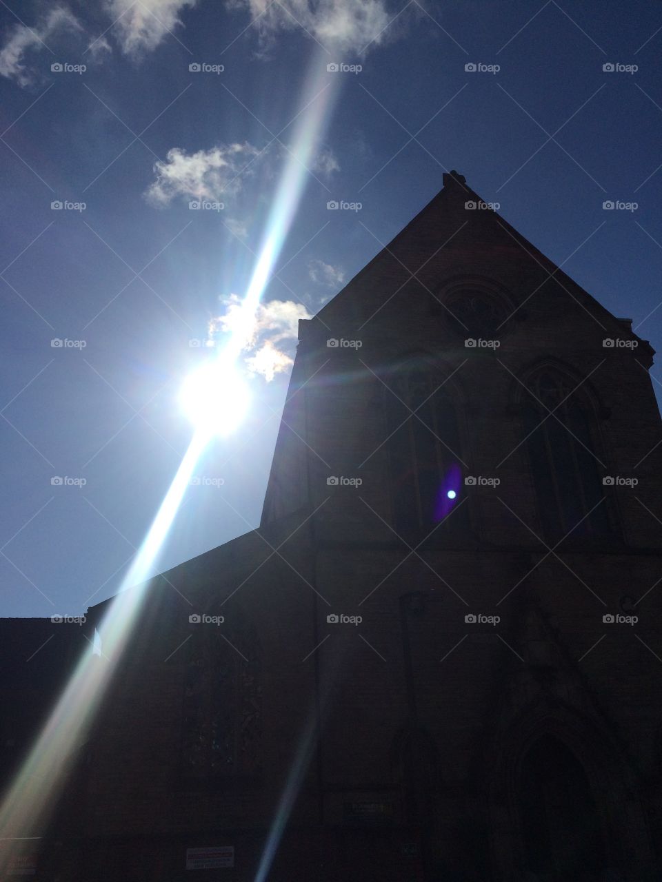 The Sun Beams behind a church