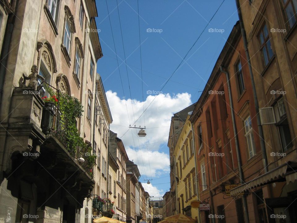 Lviv old town building architecture lanterns balcony sculptures 