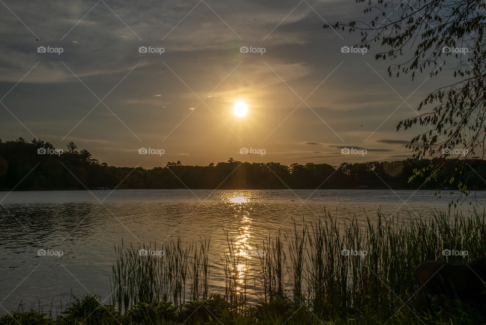 Sunset over lake in Minnesota in June. 