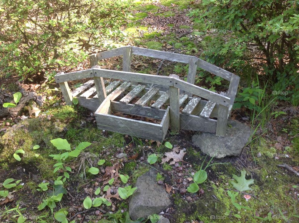 An old weathered garden bridge.