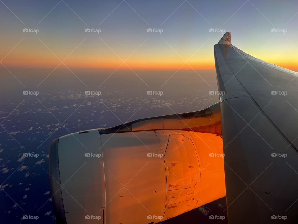 Sunset flying over the Pacific Ocean on a Hawaiian Airlines
Airbus A330