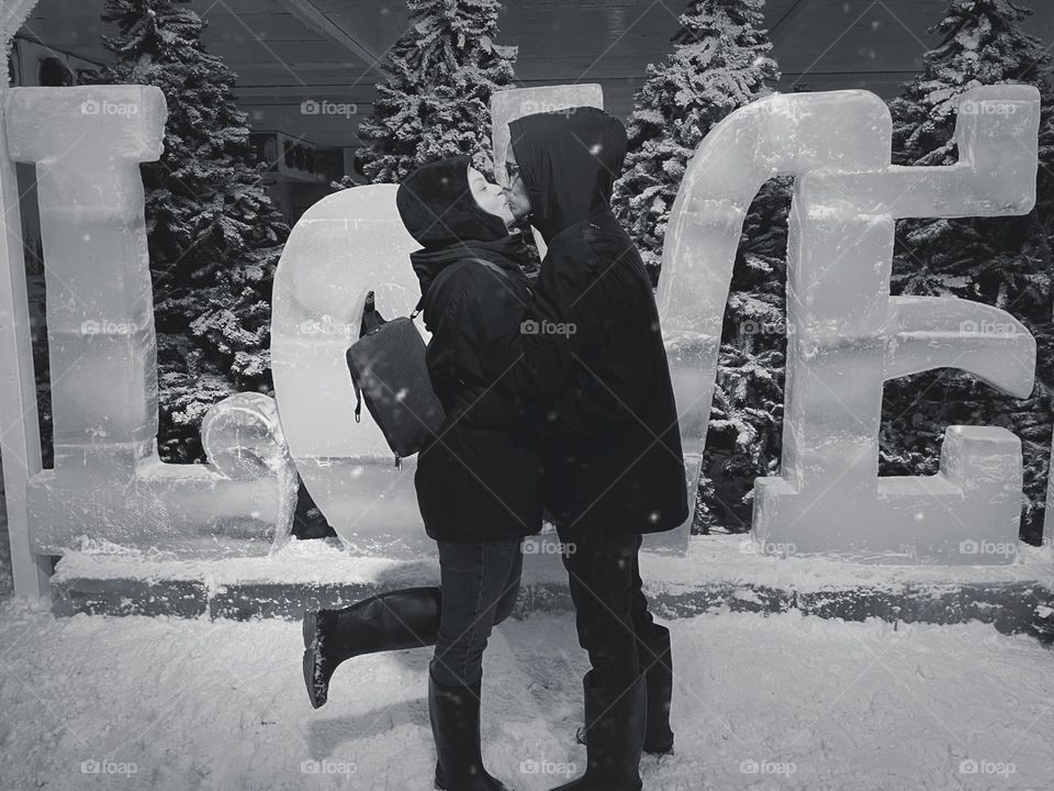 Couple approaching for a romantic kiss.