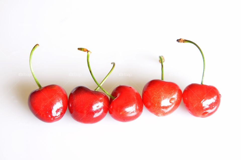 Cherries on white background