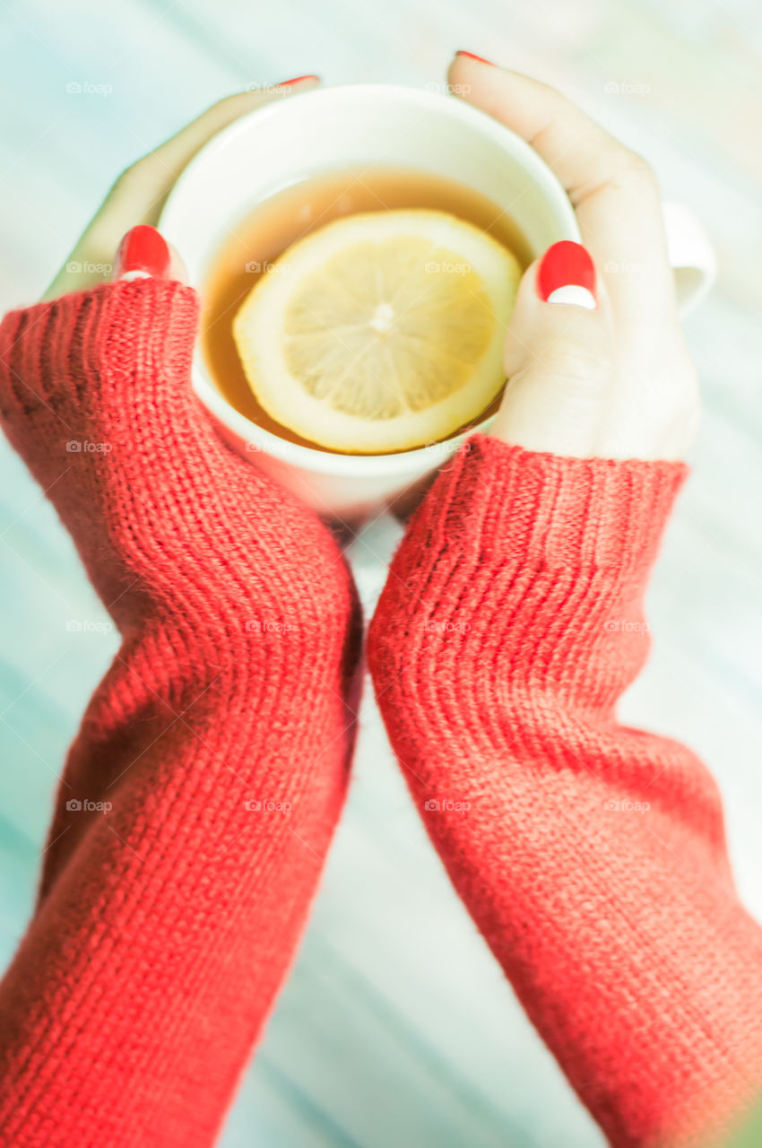 woman hand with cup of tea