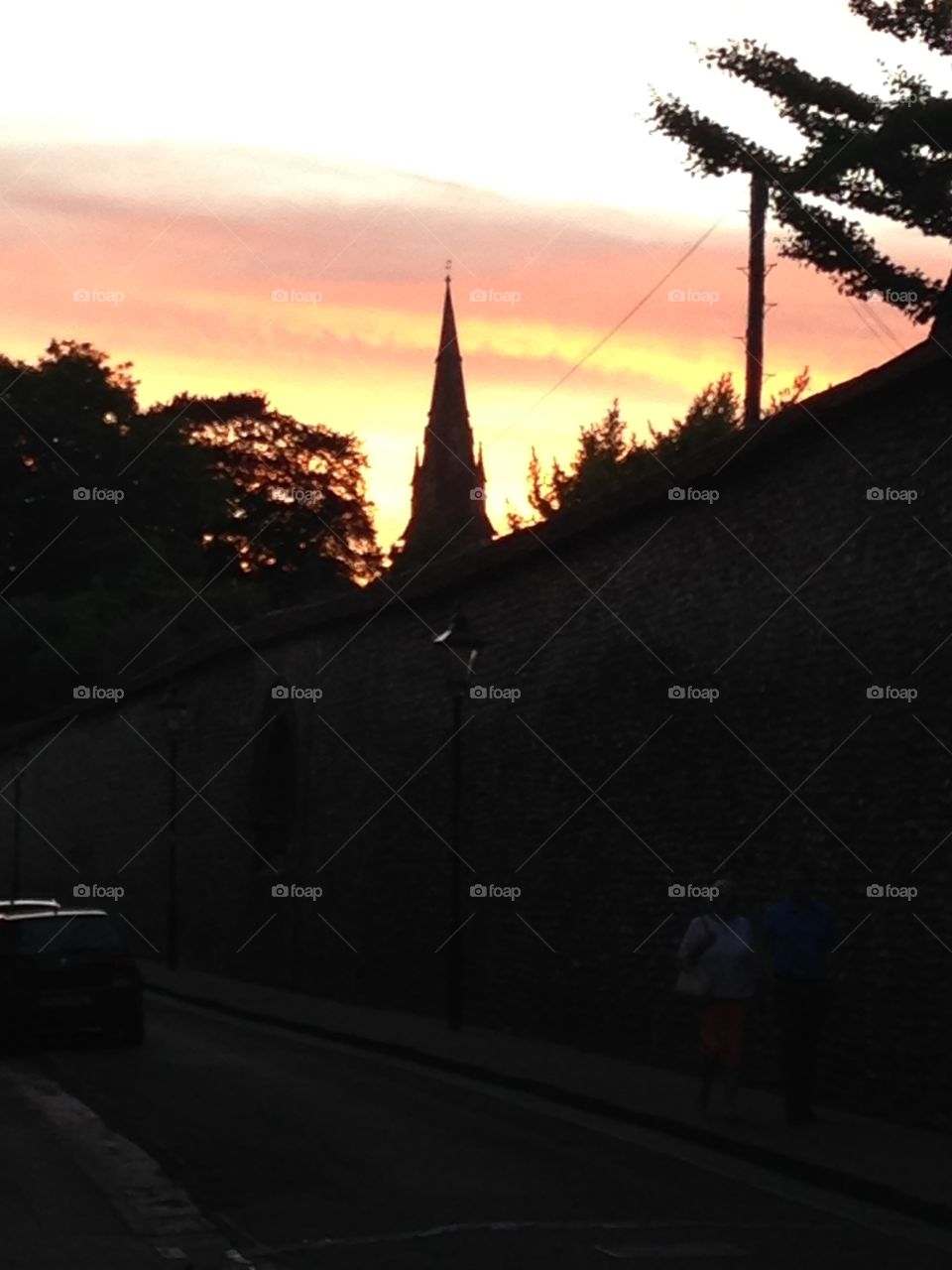 Winchester sunset . At the hat fair on a night in Winchester, Hampshire