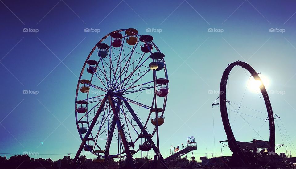 Ferris wheel and carnival ride at sunset in Lima Ohio 