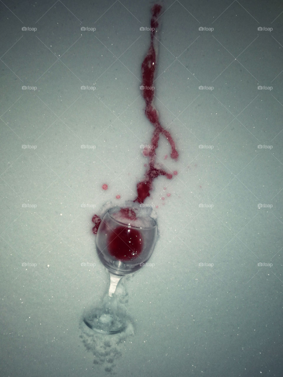 spilled red wine on the snow
