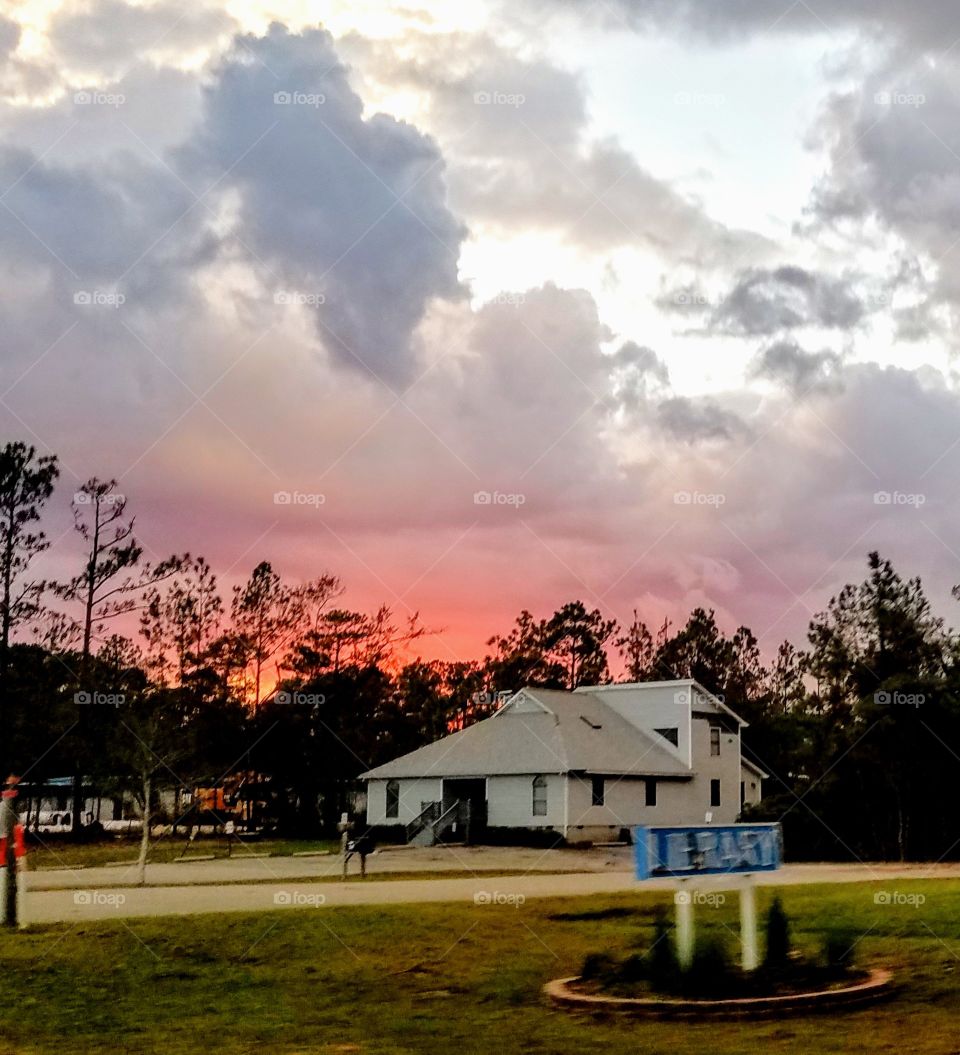 This was taken from the passenger side of a truck moving north out of Wilmington, NC checking for people needing assistance after Hurricane Florence. The pink sunset was stunning and I loved the way it "lit" the back of the old shack &gave it life!