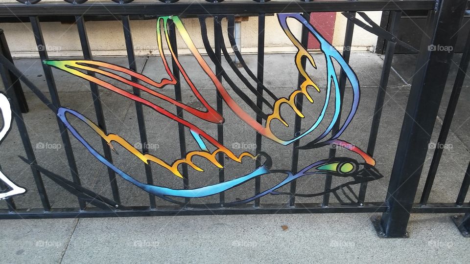 colorful iron artwork of a bird