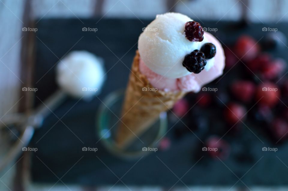 Lemon ice cream cone and berry fruit