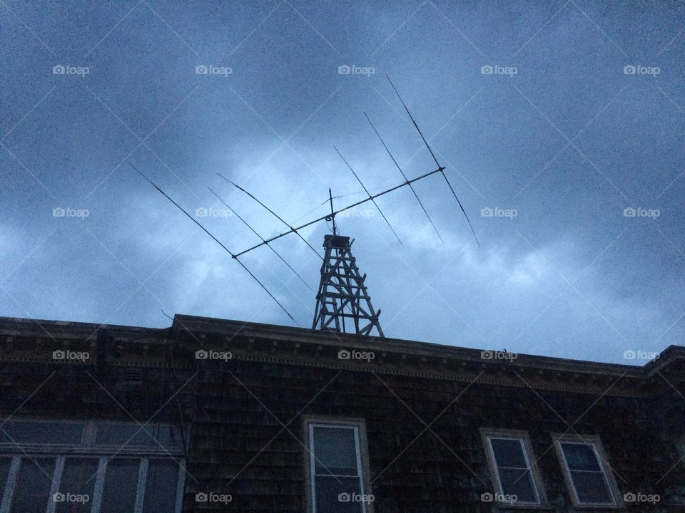 Old television antenna on an aging New England building. 