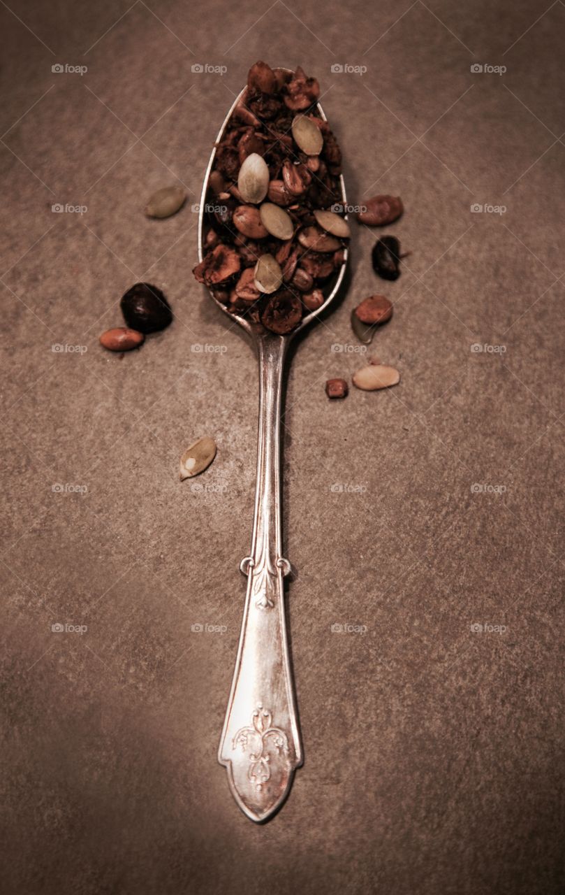 High angle view of spoon with granola