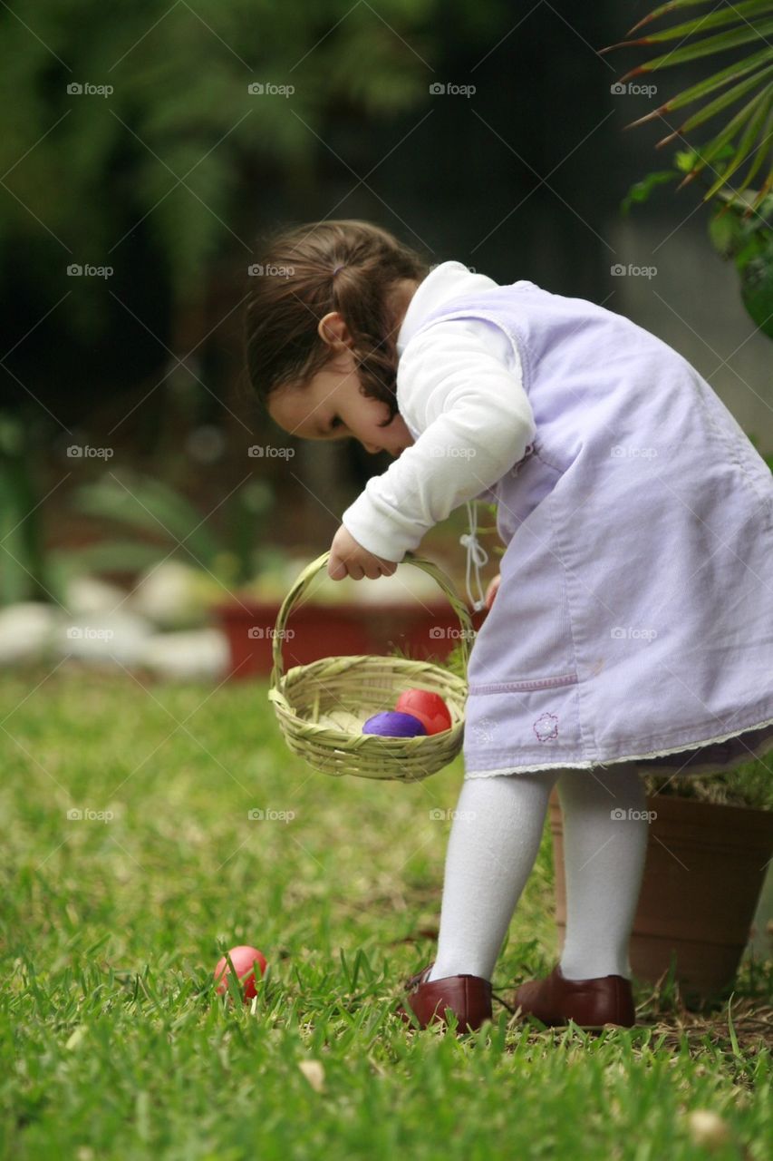 Easter egg hunting little girl