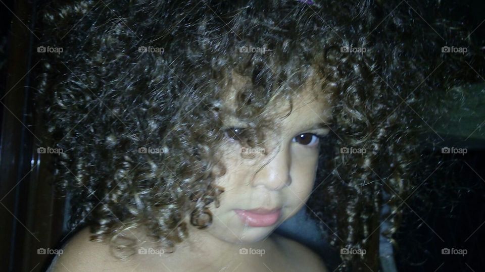 Cute little girl with curly hair