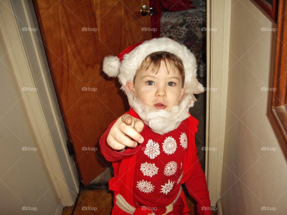 Young Boy In Santa Claus Costume
