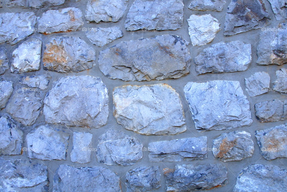 Old stonewall facade made of rocks