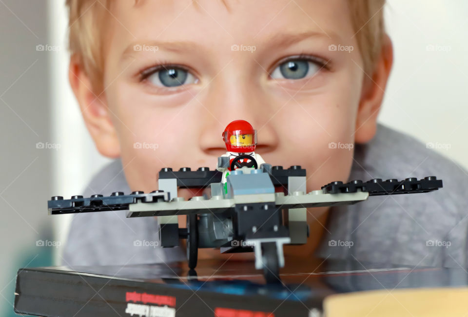 Lego airplane on the book