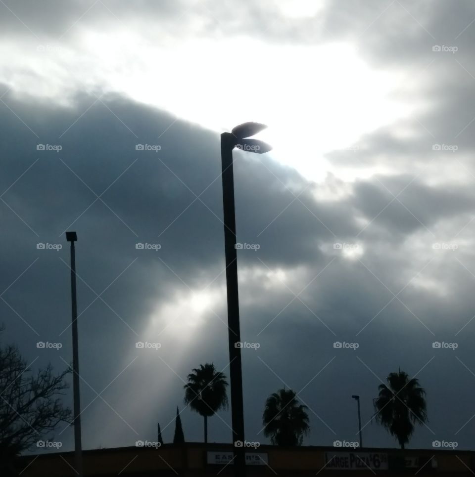 beautiful sun aura through the clouds. Sacramento, California