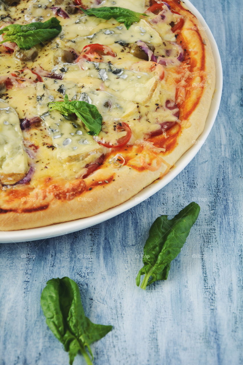 Pizza. Pizza with blue cheese on wooden background