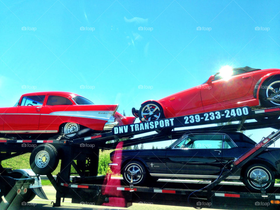 Classic cars on tow truck