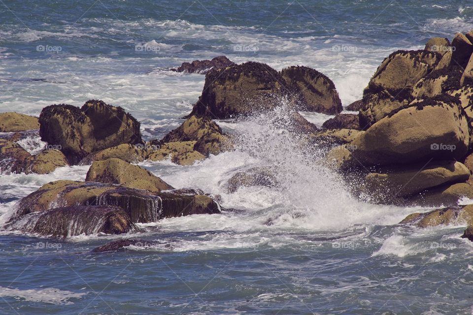 waves crashing on rocks