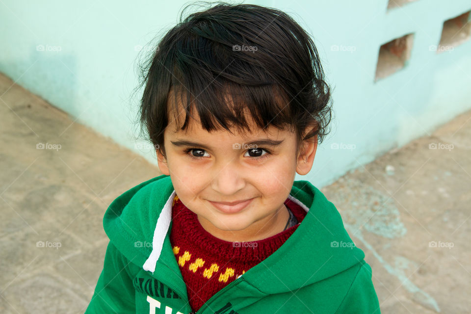 Cute Indian baby boy during winter with warm clothes