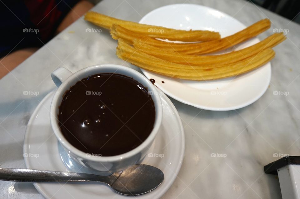 The best churros with chocolate in Madrid at Chocolatería San Ginés.