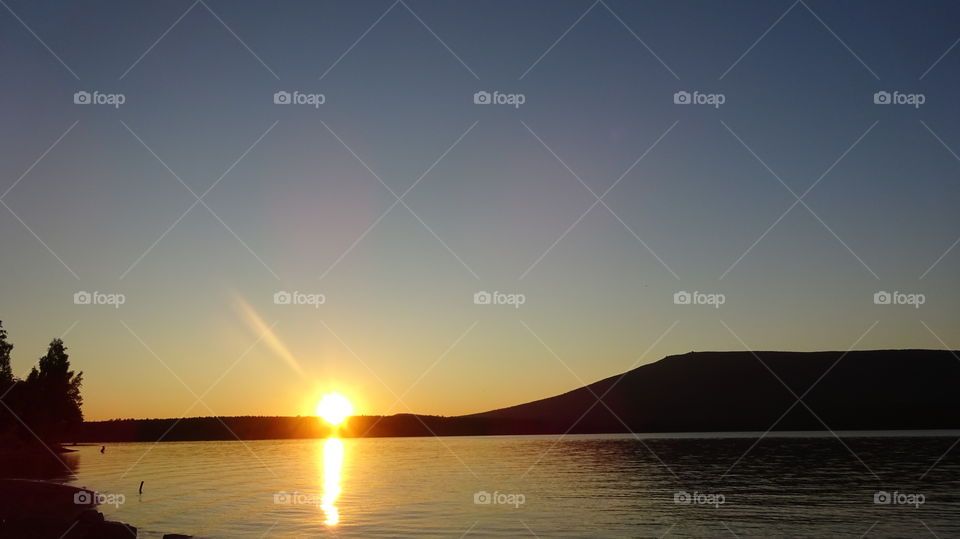 summer sunset over the mountain Kachkanar in the Urals in Russia