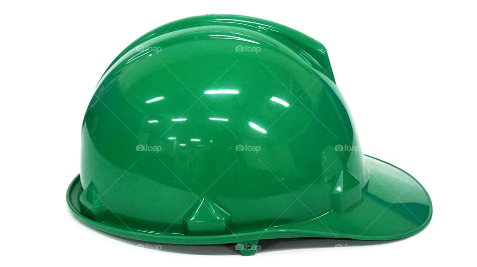 green safety helmet, this helmet must be worn by workers when working in construction to protect their heads from work accidents, the helmet is one of the safety equipment