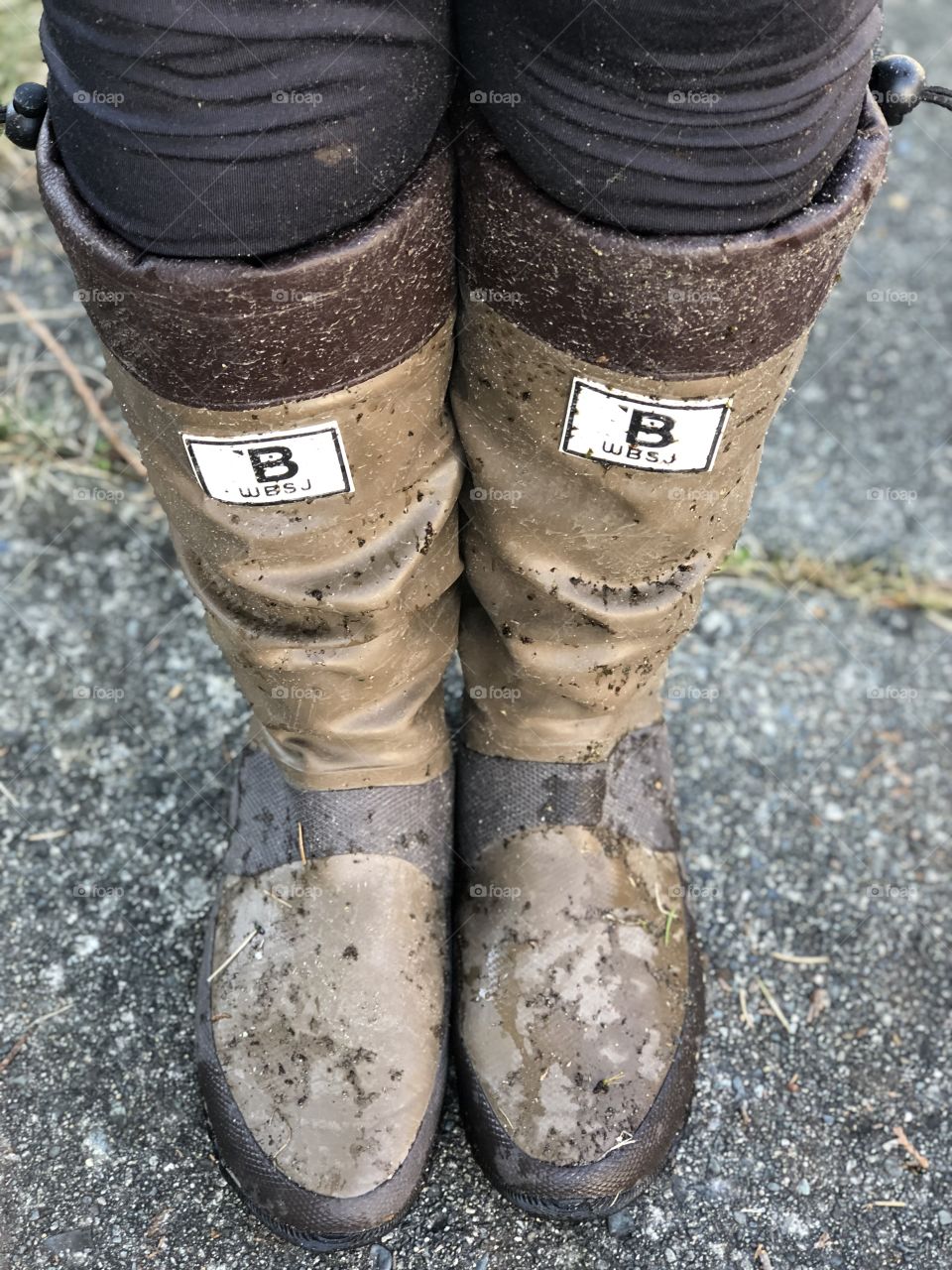 Muddy boots on feet