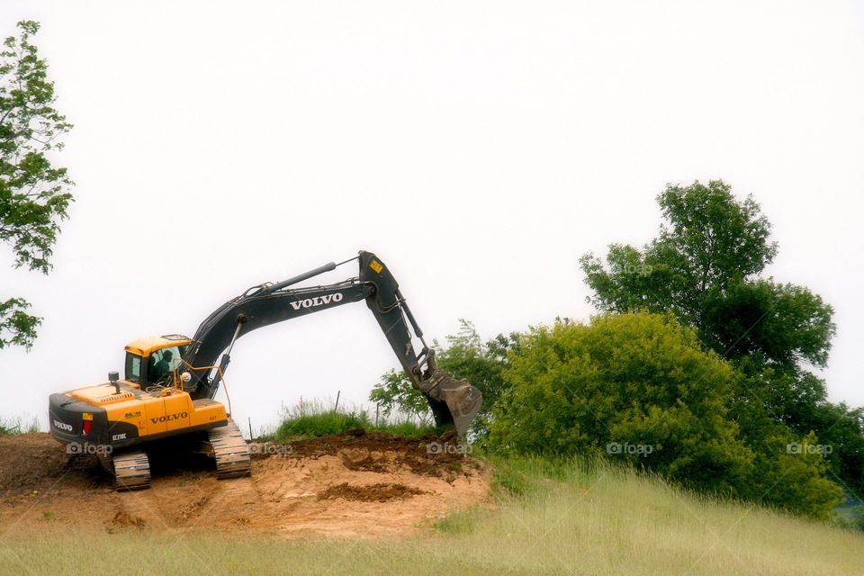Digging a Ditch.  Volvo heavy equipment in action.